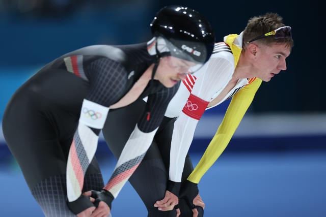 (260208) -- MILAN, Feb. 8, 2026 (Xinhua) -- Bart Swings (R) of Belgium reacts after the speed skating men's 5000m match at the Milan-Cortina 2026 Olympic Winter Games in Milan, Italy, Feb. 8, 2026. (Xinhua/Li Jing)