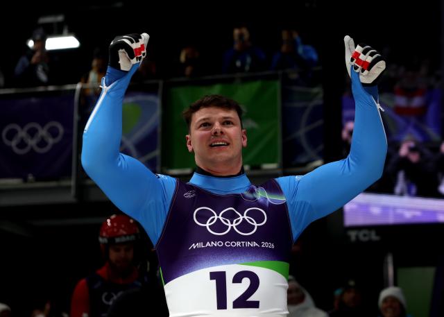(260208) -- CORTINA D'AMPEZZO, Feb. 8, 2026 (Xinhua) -- Dominik Fischnaller of Italy celebrates after the luge men's singles run 4 at the Milan-Cortina 2026 Olympic Winter Games in Cortina, Italy, Feb. 8, 2026. (Xinhua/Ding Xu)
