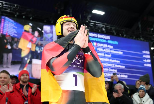 (260208) -- CORTINA D'AMPEZZO, Feb. 8, 2026 (Xinhua) -- Max Langenhan of Germany celebrates after the luge men's singles match at the Milan-Cortina 2026 Olympic Winter Games in Cortina, Italy, Feb. 8, 2026. (Xinhua/Ding Xu)