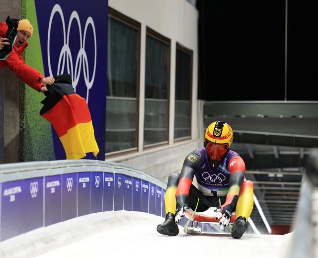 (260208) -- CORTINA D'AMPEZZO, Feb. 8, 2026 (Xinhua) -- Max Langenhan of Germany celebrates after the luge men's singles run 4 at the Milan-Cortina 2026 Olympic Winter Games in Cortina, Italy, Feb. 8, 2026. (Xinhua/Ding Xu)
