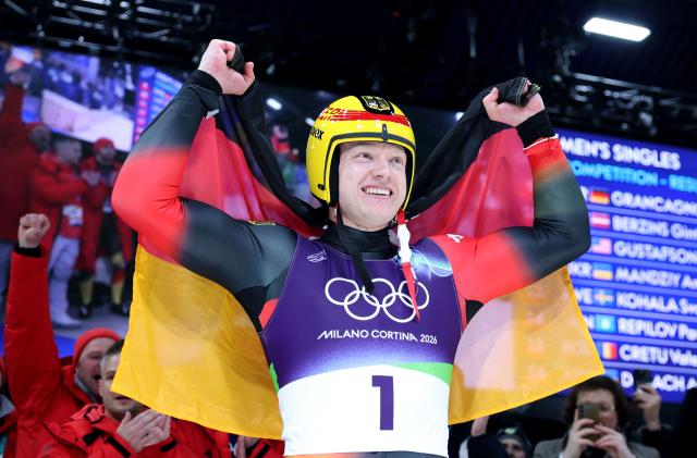 (260208) -- CORTINA D'AMPEZZO, Feb. 8, 2026 (Xinhua) -- Max Langenhan of Germany celebrates after the luge men's singles match at the Milan-Cortina 2026 Olympic Winter Games in Cortina, Italy, Feb. 8, 2026. (Xinhua/Ding Xu)