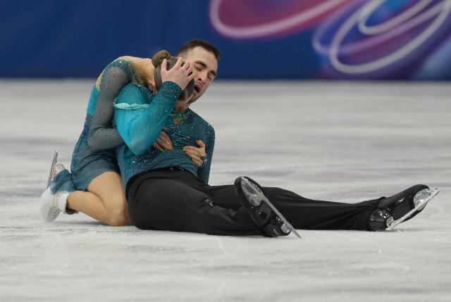 (260208) -- MILAN, Feb. 8, 2026 (Xinhua) -- Anastasiia Metelkina (L)/Luka Berulava of Georgia react after their performance during the figure skating team event pair skating free skating of the Milan-Cortina 2026 Olympic Winter Games in Milan, Italy, Feb. 8, 2026. (Xinhua/Xue Yuge)