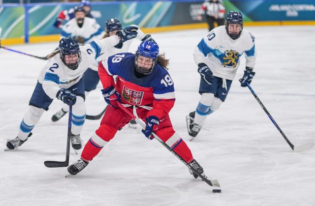 (260209) -- MILAN, Feb. 9, 2026 (Xinhua) -- Natalie Mlynkova (C) of the Czech Republic breaks through during the ice hockey women's preliminary round group A match between the Czech Republic and Finland at the Milan-Cortina 2026 Olympic Winter Games in Milan, Italy, Feb. 8, 2026. (Xinhua/Sun Fei)