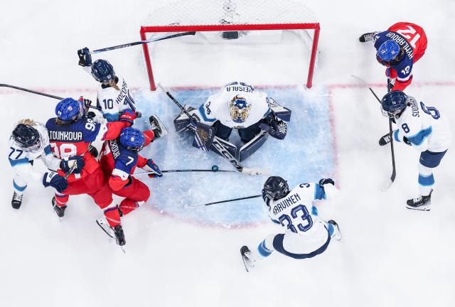 (260209) -- MILAN, Feb. 9, 2026 (Xinhua) -- Goalkeeper Klara Seroiszkova (4th L) of the Czech Republic shoots during the ice hockey women's preliminary round group A match between the Czech Republic and Finland at the Milan-Cortina 2026 Olympic Winter Games in Milan, Italy, Feb. 8, 2026. (Xinhua/Sun Fei)