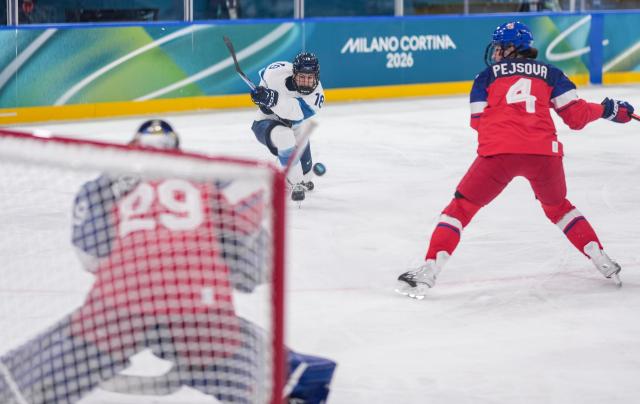 (260209) -- MILAN, Feb. 9, 2026 (Xinhua) -- Jenniina Nylund (C) of Finland shoots during the ice hockey women's preliminary round group A match between the Czech Republic and Finland at the Milan-Cortina 2026 Olympic Winter Games in Milan, Italy, Feb. 8, 2026. (Xinhua/Sun Fei)