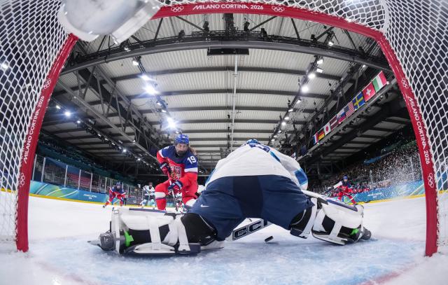 (260209) -- MILAN, Feb. 9, 2026 (Xinhua) -- Goalkeeper Anni Keisala (front) of Finland saves a goal during the ice hockey women's preliminary round group A match between the Czech Republic and Finland at the Milan-Cortina 2026 Olympic Winter Games in Milan, Italy, Feb. 8, 2026. (Xinhua/Sun Fei)