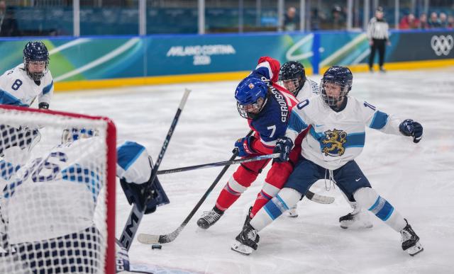(260209) -- MILAN, Feb. 9, 2026 (Xinhua) -- Klara Seroiszkova (C) of the Czech Republic shoots during the ice hockey women's preliminary round group A match between the Czech Republic and Finland at the Milan-Cortina 2026 Olympic Winter Games in Milan, Italy, Feb. 8, 2026. (Xinhua/Sun Fei)
