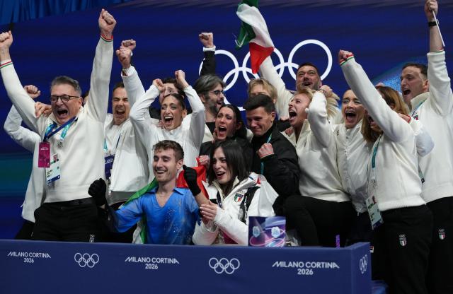 (260208) -- MILAN, Feb. 8, 2026 (Xinhua) -- Matteo Rizzo (L, front) of Italy reacts after his performance during the figure skating team event men single skating free skating of the Milan-Cortina 2026 Olympic Winter Games in Milan, Italy, Feb. 8, 2026. (Xinhua/Xue Yuge)