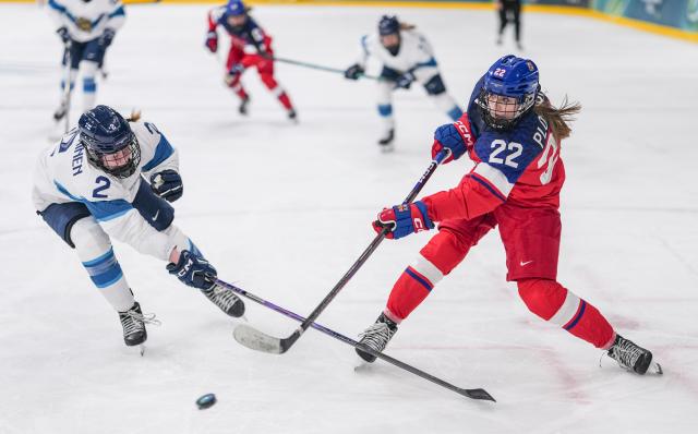(260208) -- MILAN, Feb. 8, 2026 (Xinhua) -- Tereza Plosova (R) of the Czech Republic shoots during the ice hockey women's preliminary round group A match between the Czech Republic and Finland at the Milan-Cortina 2026 Olympic Winter Games in Milan, Italy, Feb. 8, 2026. (Xinhua/Sun Fei)