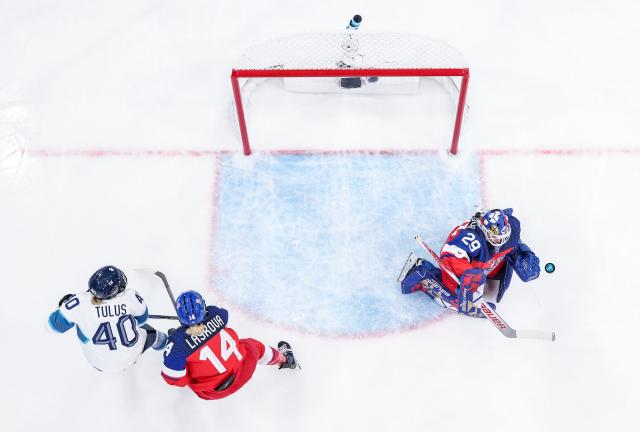 (260208) -- MILAN, Feb. 8, 2026 (Xinhua) -- Goalkeeper Klara Peslarova (R) of the Czech Republic saves a goal during the ice hockey women's preliminary round group A match between the Czech Republic and Finland at the Milan-Cortina 2026 Olympic Winter Games in Milan, Italy, Feb. 8, 2026. (Xinhua/Sun Fei)