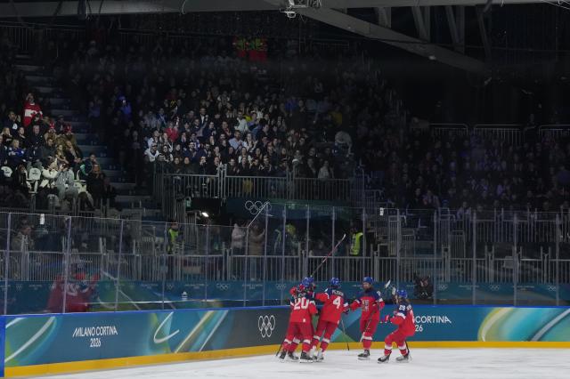(260208) -- MILAN, Feb. 8, 2026 (Xinhua) -- Players of the Czech Republic celebrate after scoring a goal during the ice hockey women's preliminary round group A match between the Czech Republic and Finland at the Milan-Cortina 2026 Olympic Winter Games in Milan, Italy, Feb. 8, 2026. (Xinhua/Sun Fei)