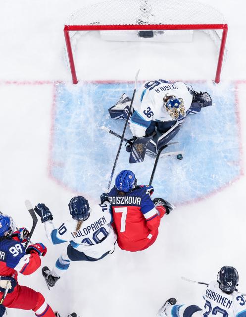 (260208) -- MILAN, Feb. 8, 2026 (Xinhua) -- Klara Seroiszkova (3rd L) of the Czech Republic shoots during the ice hockey women's preliminary round group A match between the Czech Republic and Finland at the Milan-Cortina 2026 Olympic Winter Games in Milan, Italy, Feb. 8, 2026. (Xinhua/Sun Fei)