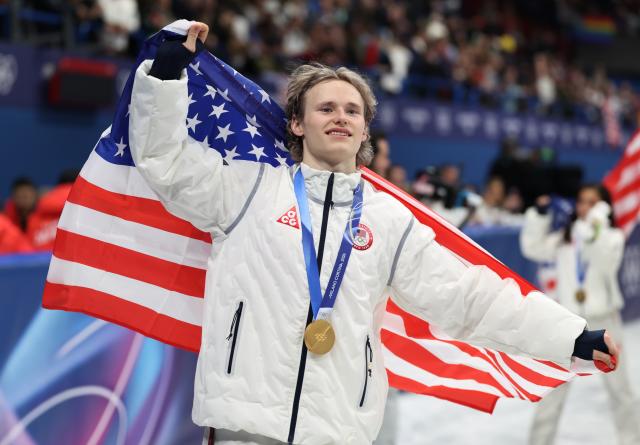 (260209) -- MILAN, Feb. 9, 2026 (Xinhua) -- Ilia Malinin of team the United States celebrates with his gold medal after the awarding ceremony for the figure skating team event of the Milan-Cortina 2026 Olympic Winter Games in Milan, Italy, Feb. 8, 2026. (Xinhua/Li Ming)