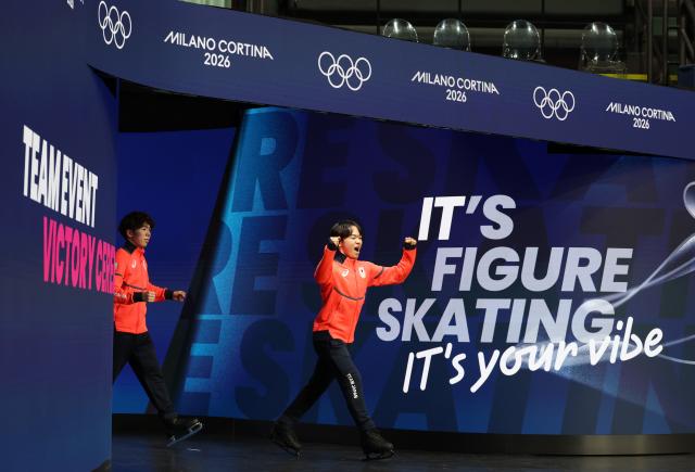 (260209) -- MILAN, Feb. 9, 2026 (Xinhua) -- Kagiyama Yuma (R) of team Japan reacts during the awarding ceremony for the figure skating team event of the Milan-Cortina 2026 Olympic Winter Games in Milan, Italy, Feb. 8, 2026. (Xinhua/Li Ming)