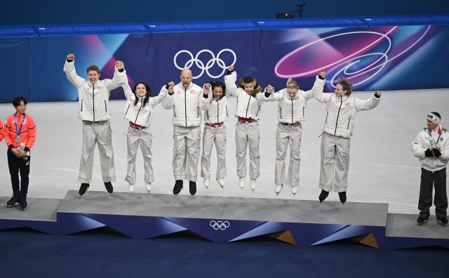 (260209) -- MILAN, Feb. 9, 2026 (Xinhua) -- Gold medalists team the United States jump on the podium during the awarding ceremony for the figure skating team event of the Milan-Cortina 2026 Olympic Winter Games in Milan, Italy, Feb. 8, 2026. (Xinhua/Cheng Min)
