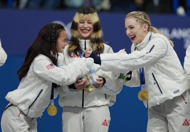 (260209) -- MILAN, Feb. 9, 2026 (Xinhua) -- Gold medalists Ellie Kam (L), Amber Glenn (R) and Alysa Liu of team the United States react on the podium during the awarding ceremony for the figure skating team event of the Milan-Cortina 2026 Olympic Winter Games in Milan, Italy, Feb. 8, 2026. (Xinhua/Xue Yuge)