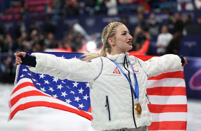 (260209) -- MILAN, Feb. 9, 2026 (Xinhua) -- Amber Glenn of team the United States celebrates with her gold medal after the awarding ceremony for the figure skating team event of the Milan-Cortina 2026 Olympic Winter Games in Milan, Italy, Feb. 8, 2026. (Xinhua/Li Ming)