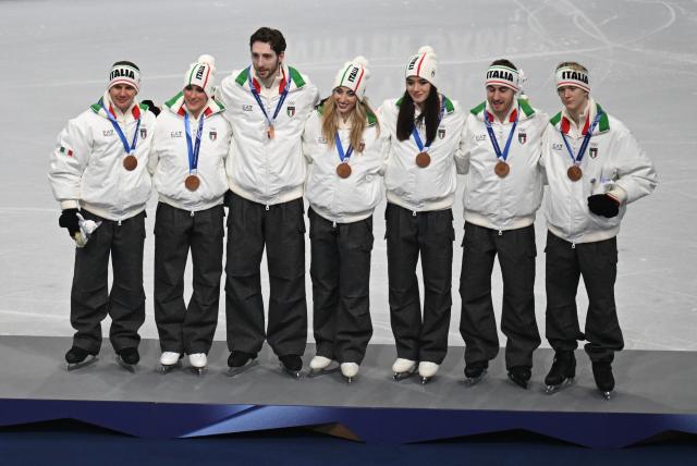 (260209) -- MILAN, Feb. 9, 2026 (Xinhua) -- Bronze medalists team Italy pose for photos during the awarding ceremony for the figure skating team event of the Milan-Cortina 2026 Olympic Winter Games in Milan, Italy, Feb. 8, 2026. (Xinhua/Cheng Min)