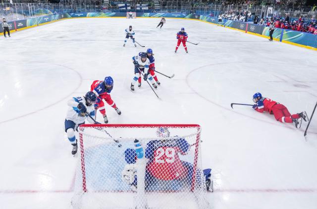 (260208) -- MILAN, Feb. 8, 2026 (Xinhua) -- Julia Liikala (1st L) of Finland shoots during the ice hockey women's preliminary round group A match between the Czech Republic and Finland at the Milan-Cortina 2026 Olympic Winter Games in Milan, Italy, Feb. 8, 2026. (Xinhua/Sun Fei)