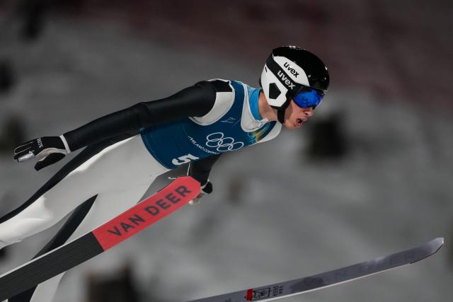 (260209) -- PREDAZZO, Feb. 9, 2026 (Xinhua) -- Daniel Andrei Cacina of Romania competes during the Ski Jumping Men's Normal Hill second Official Training of the 2026 Milan-Cortina Winter Olympics in Predazzo, Italy, Feb. 8, 2026. (Xinhua/Huang Wei)