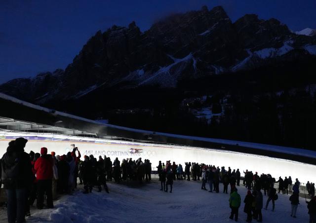 (260209) -- CORTINA D'AMPEZZO, Feb. 9, 2026 (Xinhua) -- Bao Zhenyu of China competes during the luge men's singles run 3 at the Milan-Cortina 2026 Olympic Winter Games in Cortina, Italy, Feb. 8, 2026. (Xinhua/Li Gang)