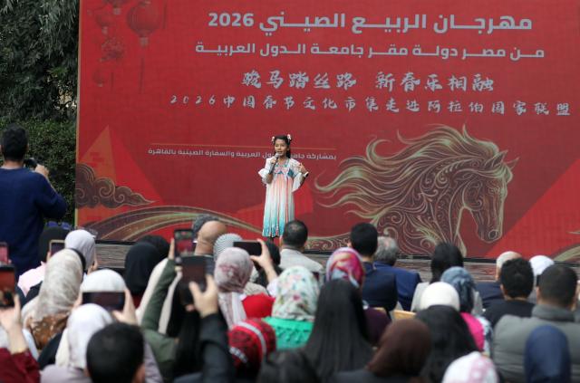 (260209) -- CAIRO, Feb. 9, 2026 (Xinhua) -- A student studying Chinese performs during a 2026 Chinese Spring Festival celebration in Cairo, Egypt, on Feb. 8, 2026. Cairo's Swiss Club hosted celebrations on Sunday for the 2026 Chinese Spring Festival, welcoming the Year of the Horse with food, art and performances that drew nearly 1,000 Egyptians and more than 200 Chinese residents. TO GO WITH "Cultural fusion marks "Year of the Horse" celebrations in Cairo" (Xinhua/Ahmed Gomaa)