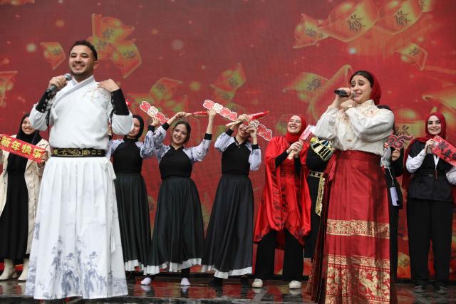 (260209) -- CAIRO, Feb. 9, 2026 (Xinhua) -- Students studying Chinese perform during a 2026 Chinese Spring Festival celebration in Cairo, Egypt, on Feb. 8, 2026. Cairo's Swiss Club hosted celebrations on Sunday for the 2026 Chinese Spring Festival, welcoming the Year of the Horse with food, art and performances that drew nearly 1,000 Egyptians and more than 200 Chinese residents. TO GO WITH "Cultural fusion marks "Year of the Horse" celebrations in Cairo" (Xinhua/Ahmed Gomaa)