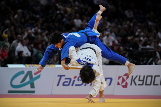 (260209) --  PARIS, Feb. 9, 2026 (Xinhua) -- China's Wang Jiangnan (in blue) and Azerbaidjan's Tckaev Zelim (in white) compete in the Men's -81kg category round of 32 match at the Grand Slam judo competition in Paris, France, on Feb. 8, 2026. (Photo by Aurelien Morissard/Xinhua)