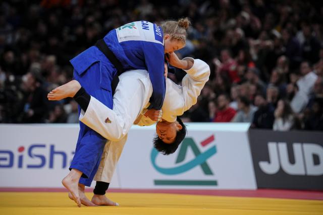 (260209) --  PARIS, Feb. 9, 2026 (Xinhua) -- -China's Ma Zhenzhao (R) and Canada's Godbout Coralie compete in the Women's -78kg category round of 16 match at the Grand Slam judo competition in Paris, France, on Feb. 8, 2026. (Photo by Aurelien Morissard/Xinhua)