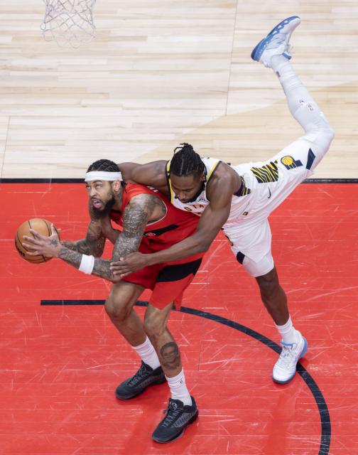 (260209) -- TORONTO, Feb. 9, 2026 (Xinhua) -- Brandon Ingram (L) of Toronto Raptors vies with Aaron Nesmith of Indiana Pacers during the 2025-2026 NBA regular season game between Toronto Raptors and Indiana Pacers in Toronto, Canada, on Feb. 8, 2026. (Photo by Zou Zheng/Xinhua)