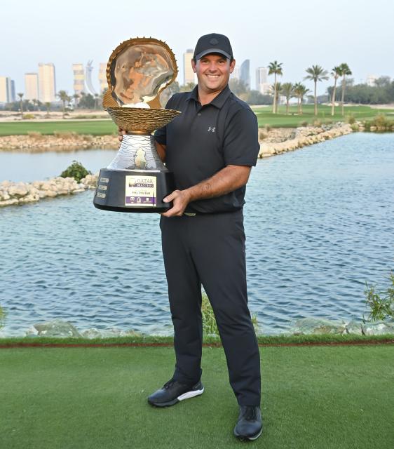 (260209) -- DOHA, Feb. 9, 2026 (Xinhua) -- Patrick Reed of the United States poses with the trophy after winning the Qatar Masters 2026 golf tournament at the Doha Golf Club in Doha, Qatar, Feb. 8, 2026. (Photo by Nikku/Xinhua)
