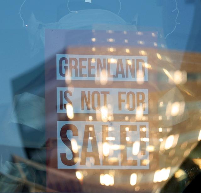 (260209) -- NUUK, Feb. 9, 2026 (Xinhua) -- This photo taken on Feb. 8, 2026 shows a poster written "GREENLAND IS NOT FOR SALE!" on a shopwindow in Nuuk, Greenland, an autonomous territory of Denmark. (Xinhua/Li Ying)