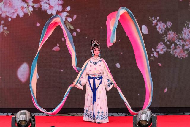 (260209) -- KAMPALA, Feb. 9, 2026 (Xinhua) -- A Chinese artist performs Chinese traditional opera during a temple fair to launch the China-Uganda Year of People-to-People Exchange and celebrate the upcoming Chinese New Year in Kampala, Uganda, Feb. 8, 2026. Uganda launched the China-Uganda Year of People-to-People Exchange on Sunday in the capital, Kampala, during a temple fair held to celebrate the upcoming Chinese New Year, also known as the Spring Festival. (Photo by Hajarah Nalwadda/Xinhua)