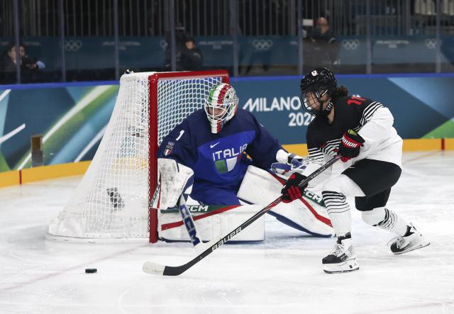 (260209) -- MILAN, Feb. 9, 2026 (Xinhua) -- Shiga Akane (R) of Japan competes during the ice hockey women's preliminary round group B match between Japan and Italy at the Milan-Cortina 2026 Olympic Winter Games in Milan, Italy, Feb. 9, 2026. (Xinhua/Lai Xiangdong)