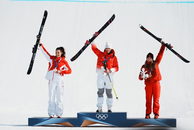 (260209) -- LIVIGNO, Feb. 9, 2026 (Xinhua) -- Gold medalist Mathilde Gremaud (C) of Switzerland, silver medalist Gu Ailing (L) of China and bronze medalist Megan Oldham of Canada react during the awarding ceremony for the freestyle skiing women's freeski slopestyle at the Milan-Cortina 2026 Olympic Winter Games in Livigno, Italy, Feb. 9, 2026. (Xinhua/Hu Chao)