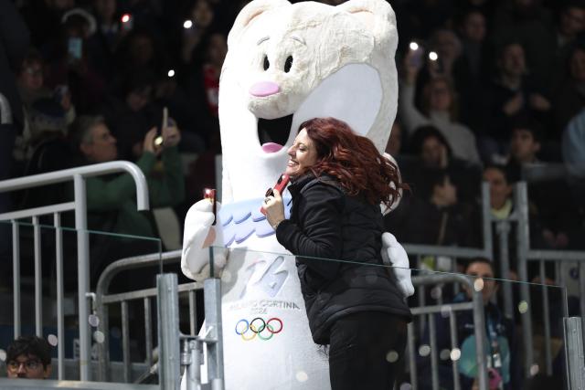 (260209) -- MILAN, Feb. 9, 2026 (Xinhua) -- People interact with Milano-Cortina 2026 Olympic Games mascot Tina during the ice hockey women's preliminary round group B match between Japan and Italy at the Milan-Cortina 2026 Olympic Winter Games in Milan, Italy, Feb. 9, 2026. (Xinhua/Lai Xiangdong)