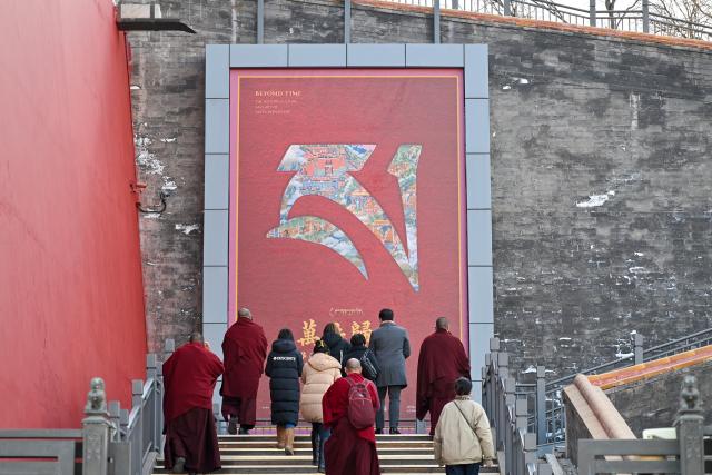(260209) -- BEIJING, Feb. 9, 2026 (Xinhua) -- People visit the exhibition "Beyond Time: the history, culture and art of Sakya Monastery" at the Palace Museum in Beijing, capital of China, Feb. 9, 2026. The exhibition, which will last till May 10, showcases over 200 relics reflecting the history, culture and art of Sakya Monastery, the earliest monastery of the Sakya Sect of the Tibetan Buddhism. (Xinhua/Li Xin)