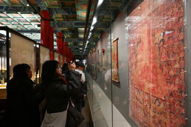 (260209) -- BEIJING, Feb. 9, 2026 (Xinhua) -- People visit the exhibition "Beyond Time: the history, culture and art of Sakya Monastery" at the Palace Museum in Beijing, capital of China, Feb. 9, 2026. The exhibition, which will last till May 10, showcases over 200 relics reflecting the history, culture and art of Sakya Monastery, the earliest monastery of the Sakya Sect of the Tibetan Buddhism. (Xinhua/Li Xin)
