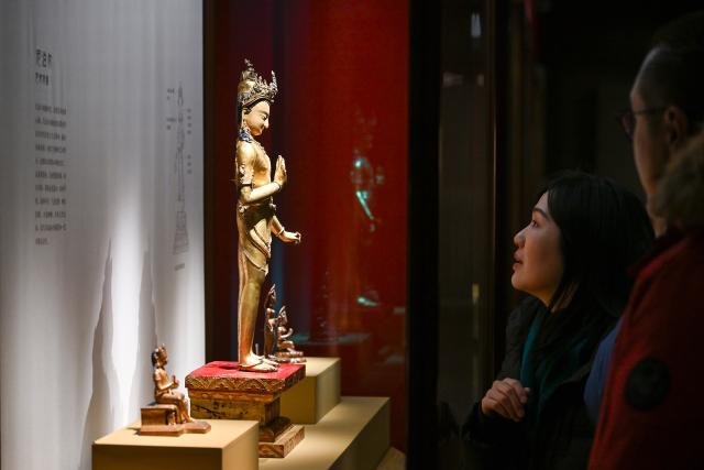 (260209) -- BEIJING, Feb. 9, 2026 (Xinhua) -- People visit the exhibition "Beyond Time: the history, culture and art of Sakya Monastery" at the Palace Museum in Beijing, capital of China, Feb. 9, 2026. The exhibition, which will last till May 10, showcases over 200 relics reflecting the history, culture and art of Sakya Monastery, the earliest monastery of the Sakya Sect of the Tibetan Buddhism. (Xinhua/Li Xin)
