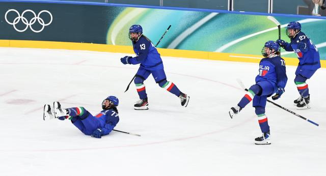 (260209) -- MILAN, Feb. 9, 2026 (Xinhua) -- Players of Italy celebrate after winning the ice hockey women's preliminary round group B match between Japan and Italy at the Milan-Cortina 2026 Olympic Winter Games in Milan, Italy, Feb. 9, 2026. (Xinhua/Wang Kaiyan)