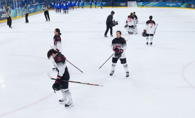 (260209) -- MILAN, Feb. 9, 2026 (Xinhua) -- Shiga Aoi (Front) of Japan looks dejected after the ice hockey women's preliminary round group B match between Japan and Italy at the Milan-Cortina 2026 Olympic Winter Games in Milan, Italy, Feb. 9, 2026. (Xinhua/Tao Xiyi)