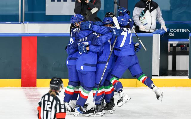(260209) -- MILAN, Feb. 9, 2026 (Xinhua) -- Players of Italy celebrate scoring during the ice hockey women's preliminary round group B match between Japan and Italy at the Milan-Cortina 2026 Olympic Winter Games in Milan, Italy, Feb. 9, 2026. (Xinhua/Wang Kaiyan)