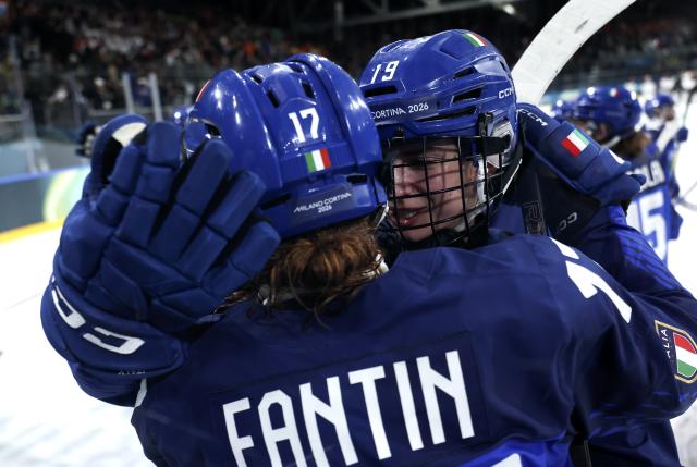 (260209) -- MILAN, Feb. 9, 2026 (Xinhua) -- Kristin Della Rovere (R) of Italy celebrates after the ice hockey women's preliminary round group B match between Japan and Italy at the Milan-Cortina 2026 Olympic Winter Games in Milan, Italy, Feb. 9, 2026. (Xinhua/Zhang Cheng)