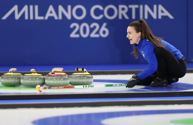 (260209) -- CORTINA D'AMPEZZO, Feb. 9, 2026 (Xinhua) -- Stefania Constantini of Italy competes competes during the curling mixed doubles semi-final between Italy and the United States at the Milan-Cortina 2026 Olympic Winter Games in Cortina, Italy, Feb. 9, 2026. (Xinhua/Ding Xu)