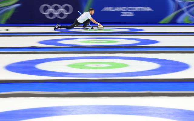 (260209) -- CORTINA D'AMPEZZO, Feb. 9, 2026 (Xinhua) -- Korey Dropkin of the United States competes during the curling mixed doubles semi-final between Italy and the United States at the Milan-Cortina 2026 Olympic Winter Games in Cortina, Italy, Feb. 9, 2026. (Xinhua/Ding Xu)