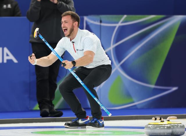 (260209) -- CORTINA D'AMPEZZO, Feb. 9, 2026 (Xinhua) -- Korey Dropkin of the United States celebrates winning the curling mixed doubles semi-final between Italy and the United States at the Milan-Cortina 2026 Olympic Winter Games in Cortina, Italy, Feb. 9, 2026. (Xinhua/Ding Xu)