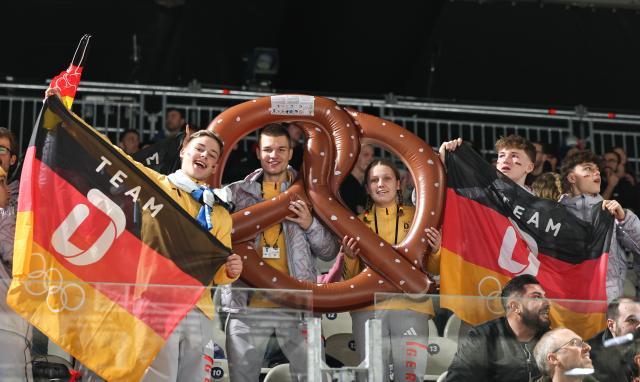 (260209) -- MILAN, Feb. 9, 2026 (Xinhua) -- Supporters of team Germany cheer before the ice hockey women's preliminary round group B match between Germany and France at the Milan-Cortina 2026 Olympic Winter Games in Milan, Italy, Feb. 9, 2026. (Xinhua/Wang Kaiyan)