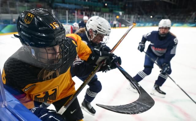 (260209) -- MILAN, Feb. 9, 2026 (Xinhua) -- Jule Schiefer (front) of Germany competes during the ice hockey women's preliminary round group B match between Germany and France at the Milan-Cortina 2026 Olympic Winter Games in Milan, Italy, Feb. 9, 2026. (Xinhua/Wang Kaiyan)