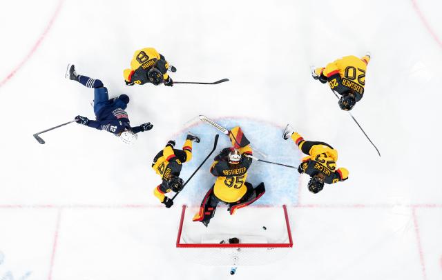 (260209) -- MILAN, Feb. 9, 2026 (Xinhua) -- Estelle Duvin (1st L) of France scores during the ice hockey women's preliminary round group B match between Germany and France at the Milan-Cortina 2026 Olympic Winter Games in Milan, Italy, Feb. 9, 2026. (Xinhua/Wang Kaiyan)