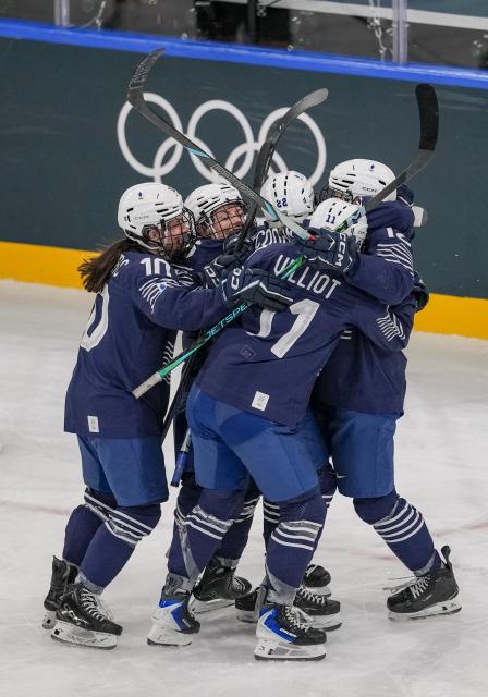 (260209) -- MILAN, Feb. 9, 2026 (Xinhua) -- Players of France celebrate a goal during the ice hockey women's preliminary round group B match between Germany and France at the Milan-Cortina 2026 Olympic Winter Games in Milan, Italy, Feb. 9, 2026. (Xinhua/Sun Fei)